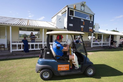 130714 - Usk Cricket Club v Newport Gwent Dragons, Charity T20 Cricket match, Usk - Newport Gwent Dragons player and former Wales and British Lions star Andy Powell makes his way to the wicket in a golf buggy as he opens the batting for the Dragons in a charity cricket match to raise money for charities Laurence Moon Bardot Beildle and St David’s Foundation Hospice Care 