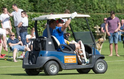 130714 - Usk Cricket Club v Newport Gwent Dragons, Charity T20 Cricket match, Usk - Newport Gwent Dragons player and former Wales and British Lions star Andy Powell makes his way to the wicket in a golf buggy as he opens the batting for the Dragons in a charity cricket match to raise money for charities Laurence Moon Bardot Beildle and St David’s Foundation Hospice Care 