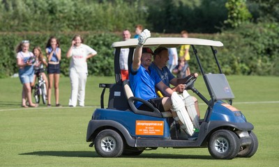 130714 - Usk Cricket Club v Newport Gwent Dragons, Charity T20 Cricket match, Usk - Newport Gwent Dragons player and former Wales and British Lions star Andy Powell makes his way to the wicket in a golf buggy as he opens the batting for the Dragons in a charity cricket match to raise money for charities Laurence Moon Bardot Beildle and St David’s Foundation Hospice Care 