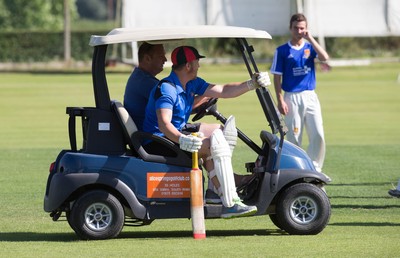 130714 - Usk Cricket Club v Newport Gwent Dragons, Charity T20 Cricket match, Usk - Newport Gwent Dragons player and former Wales and British Lions star Andy Powell makes his way to the wicket in a golf buggy as he opens the batting for the Dragons in a charity cricket match to raise money for charities Laurence Moon Bardot Beildle and St David’s Foundation Hospice Care 