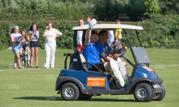 130714 - Usk Cricket Club v Newport Gwent Dragons, Charity T20 Cricket match, Usk - Newport Gwent Dragons player and former Wales and British Lions star Andy Powell makes his way to the wicket in a golf buggy as he opens the batting for the Dragons in a charity cricket match to raise money for charities Laurence Moon Bardot Beildle and St David’s Foundation Hospice Care 