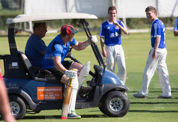 130714 - Usk Cricket Club v Newport Gwent Dragons, Charity T20 Cricket match, Usk - Newport Gwent Dragons player and former Wales and British Lions star Andy Powell makes his way to the wicket in a golf buggy as he opens the batting for the Dragons in a charity cricket match to raise money for charities Laurence Moon Bardot Beildle and St David’s Foundation Hospice Care 