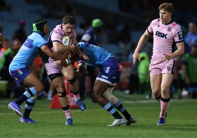 200326 - Vodacom Bulls v Cardiff Rugby - United Rugby Championship - Harri Millard of Cardiff is tackled by Kurt-Lee Arendse and Canan Moodie of Vodacom Bulls