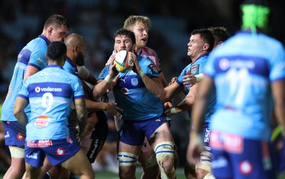 200326 - Vodacom Bulls v Cardiff Rugby - United Rugby Championship - Ruan Nortje of Vodacom Bulls is tackled by Dan Thomas of Cardiff