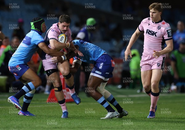 200326 - Vodacom Bulls v Cardiff Rugby - United Rugby Championship - Harri Millard of Cardiff is tackled by Kurt-Lee Arendse and Canan Moodie of Vodacom Bulls