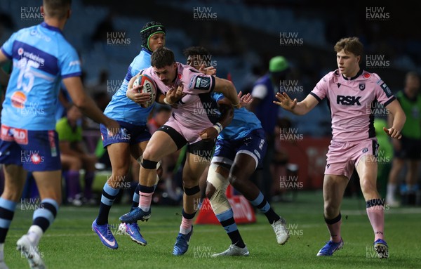 200326 - Vodacom Bulls v Cardiff Rugby - United Rugby Championship - Harri Millard of Cardiff is tackled by Kurt-Lee Arendse and Canan Moodie of Vodacom Bulls