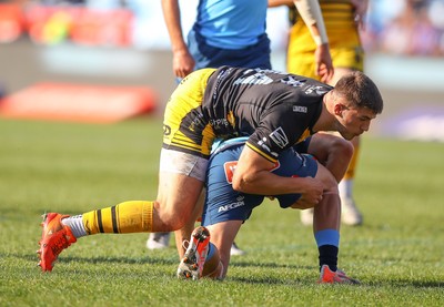 170525 - Vodacom Bulls v Dragons RFC - United Rugby Championship - Harry Rees-Weldon of the Dragons over the top on the tackle of Zak Burger of the Vodacom Blue Bulls