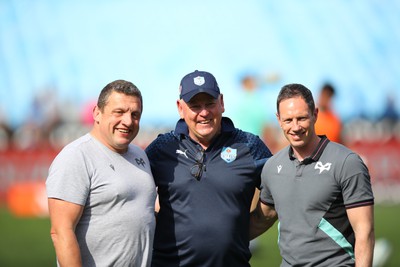 270424 - Vodacom Bulls v Ospreys - United Rugby Championship - Ospreys head coach Toby Booth, Bulls head coach Jake White and Ospreys rugby general manager Dan Griffiths before the match