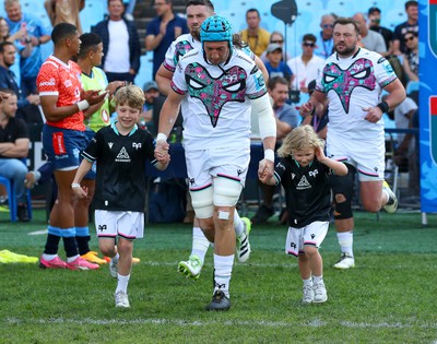 270424 - Vodacom Bulls v Ospreys - United Rugby Championship - Ospreys captain Justin Tipuric enters the field with mascots