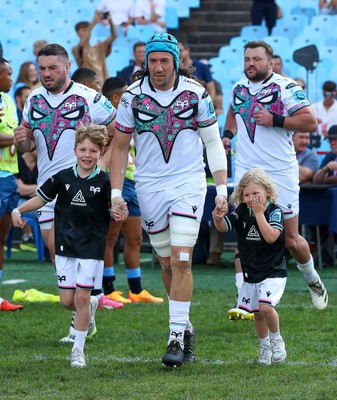 270424 - Vodacom Bulls v Ospreys - United Rugby Championship - Ospreys captain Justin Tipuric enters the field with mascots