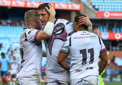 270424 - Vodacom Bulls v Ospreys - United Rugby Championship - Keiran Williams of the Ospreys congratulated after scoring his try