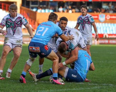 270424 - Vodacom Bulls v Ospreys - United Rugby Championship - Dewi Lake of the Ospreys tackled by Chris Smith of the Vodacom Blue Bulls