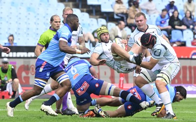 270925 - Vodacom Bulls v Ospreys, United Rugby Championship - Harri Deaves of Ospreys is tackled by Mornay Smith of Bulls 