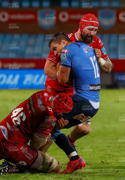 180322 - Vodacom Bulls v Scarlets - United Rugby Championship - Sione Kalamafoni and Blade Thomson of the Scarlets tackle Harold Vorster of the Vodacom Bulls