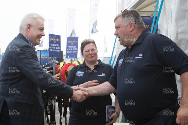 270518 - Volvo Ocean Race, Cardiff Bay -  First Minister Carwyn Jones tours the race stopover area meeting representatives from the RNLI