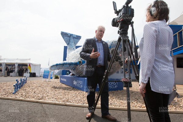 270518 - Volvo Ocean Race, Cardiff Bay -  First Minister Carwyn Jones is interviewed in the race stopover area 