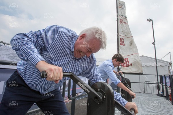 270518 - Volvo Ocean Race, Cardiff Bay -  First Minister Carwyn Jones and Huw Thomas, Leader of Cardiff City Council, take on the Musto grinder challenge