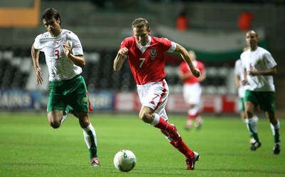 150806Wales v Bulgaria International Friendly, The Liberty Stadium, Swansea -  Wales' Craig Bellamy breaks past Rosen Kirilov 