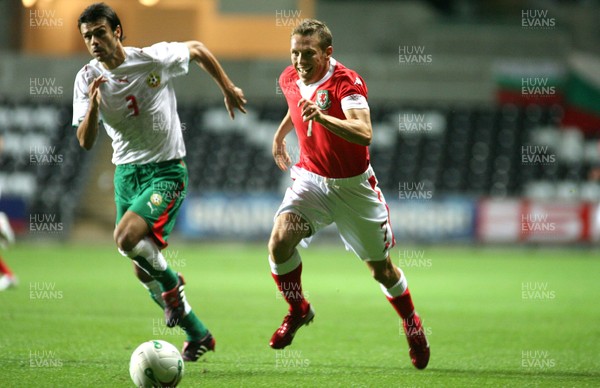150806Wales v Bulgaria International Friendly, The Liberty Stadium, Swansea -  Wales' Craig Bellamy breaks past Rosen Kirilov 