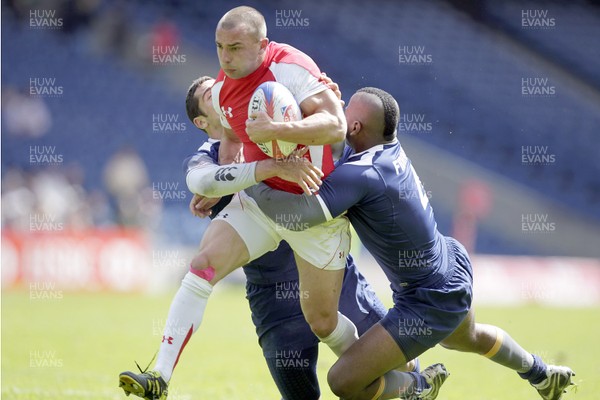 29.05.11Wales v France..IRB World Sevens Series Murrayfield... Wales' Nicky Griffiths  challenged by France's Manoel Dall Igna (L) and Jean Charles Fidinde during an IRB World Series rugby sevens cup quarter-final match. 