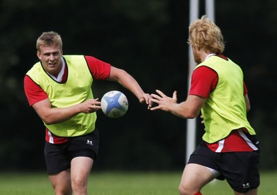 07.09.10 Wales 7's Commonwealth Training Squad -  Jevon Groves pops a pass the Richie Pugh during squad training at RAF Halten. 