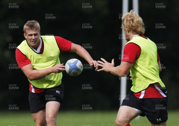 07.09.10 Wales 7's Commonwealth Training Squad -  Jevon Groves pops a pass the Richie Pugh during squad training at RAF Halten. 
