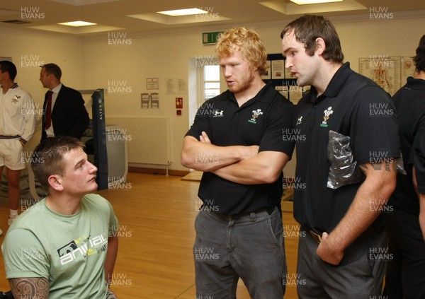 07.09.10 Wales 7's Commonwealth Training Squad - The Medical Rehabilitation unit: Hedly Hall -  Royal Marine Joe Townsend chats to Richie Pugh(C) & Rhys Shellard. 