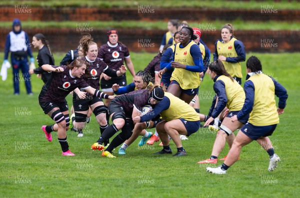 171023 - Wales Women and France Women combined training session - Bethan Lewis, Abbie Fleming and Georgia Evans charge forward during a combined training session against France Women ahead of their first matches in WXV1