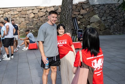 260625 - Wales Rugby arrive in Kitakyushu - Josh Adams with fans