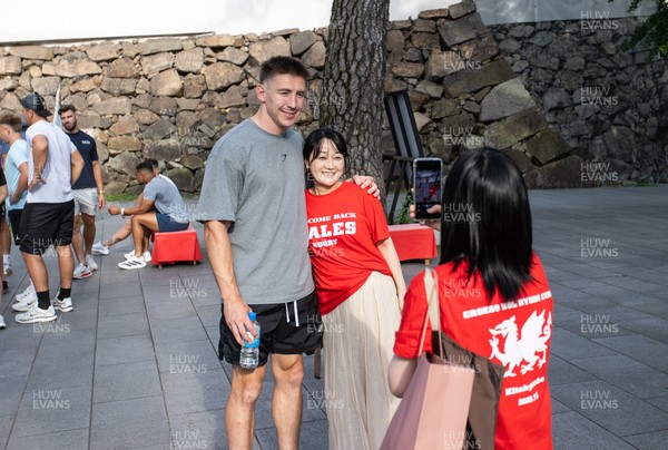 260625 - Wales Rugby arrive in Kitakyushu - Josh Adams with fans