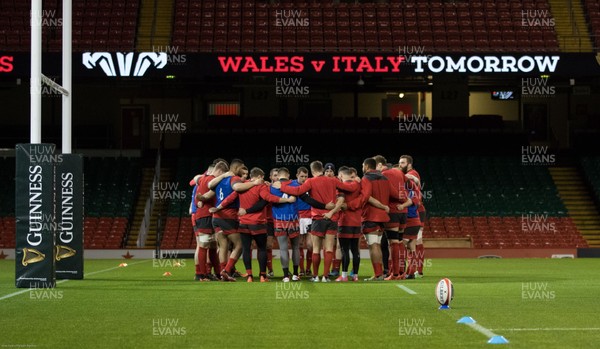 310120 - Wales Captain's Run, Principality Stadium - The Wales Squad huddle together during training ahead of the opening Guinness Six Nations match against Italy