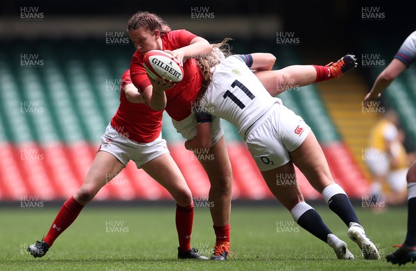 300419 - Wales Women Emerging Talent v England U18s Development Group - Madi Johns of Wales is tackled by Jodie Ounsley of England