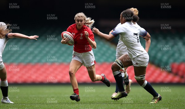 300419 - Wales Women Emerging Talent v England U18s Development Group - Bethan Huntley of Wales is tackled by Maisie James of England