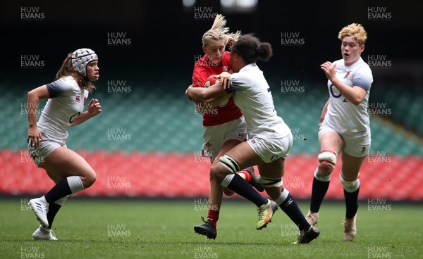 300419 - Wales Women Emerging Talent v England U18s Development Group - Bethan Huntley of Wales is tackled by Maisie James of England