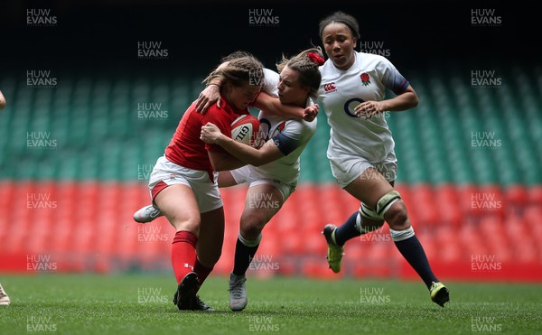 300419 - Wales Women Emerging Talent v England U18s Development Group - Mabli Davies of Wales is tackled by Holly Thorpe of England