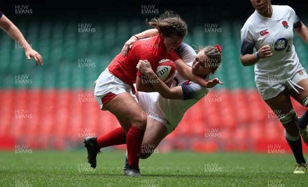 300419 - Wales Women Emerging Talent v England U18s Development Group - Mabli Davies of Wales is tackled by Holly Thorpe of England