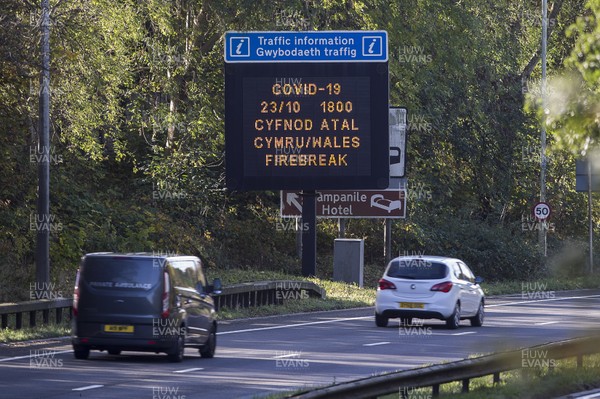 221020 - Picture shows a sign informing motorist driving into Cardiff of the Firebreak lockdown starting in Wales tomorrow (23rd October) at 6pm
