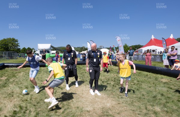 300523 - Wales Football manager Rob Page, right, and Wales U21 manager Matty Joness, watch young players at The Urdd National Eisteddfod in Llandovery