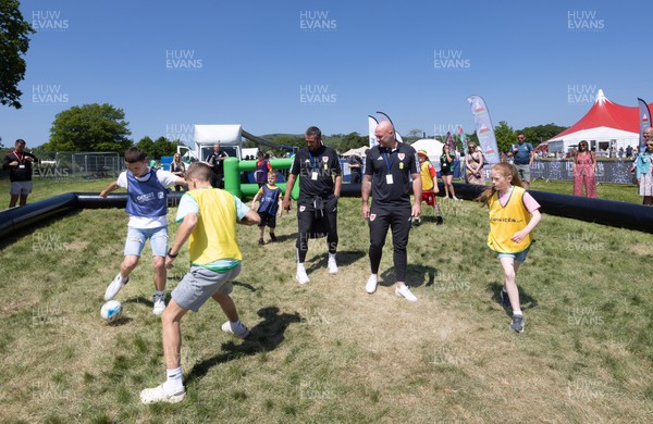 300523 - Wales Football manager Rob Page, right, and Wales U21 manager Matty Joness, watch young players at The Urdd National Eisteddfod in Llandovery