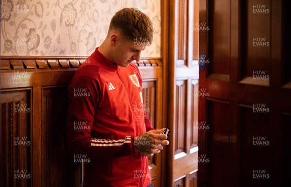 141122 - Wales Football Media Interviews - Joe Rodon of Wales waits his turn during a media interview session ahead of the Wales team departure for the FIFA World Cup in Qatar