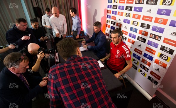 181119 - Wales Football Press Conference - Wales' Gareth Bale takes his seat before he speaks to the media during press conference ahead of the Euro 2020 Qualifier against Hungary 