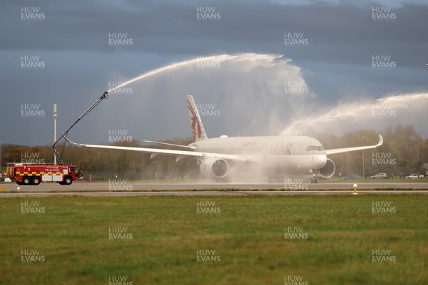 151122 - Wales Football Squad Departs For Qatar From Cardiff Airport - Plane carrying the Welsh squad under water jets