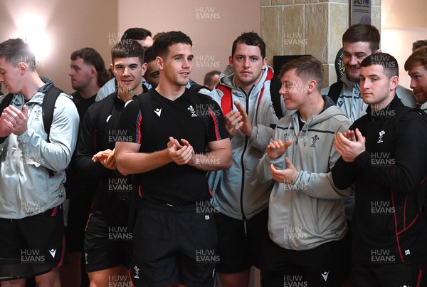 151122 - Wales Football Squad Depart for FIFA World Cup - Wales rugby players Joe Hawkins, Kieran Hardy, Ryan Elias and Sam Costelow applaud the Wales football squad as they depart for Qatar