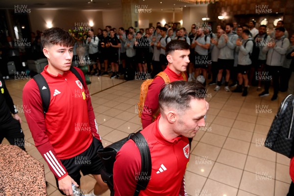 151122 - Wales Football Squad Depart for FIFA World Cup - Rubin Colwill, Dylan Levitt, Connor Roberts leave the Vale Resort as Wales rugby players applaud the Wales football squad as they depart for Qatar