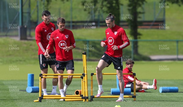 040621 - Wales Football Squad Training Session - Kieffer Moore, Aaron Ramsey and Gareth Bale during training session ahead of their friendly match against Albania