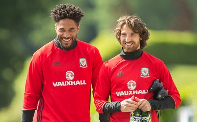 070617 - Wales Football Training Session - Wales' Ashley Williams and Joe Allen make their way down to the training session ahead of the FIFA World Cup Qualifying match against Serbia