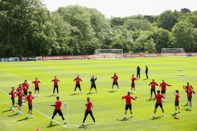 070617 - Wales Football Training Session - The Wales Squad warm up at the start of the training session ahead of the FIFA World Cup Qualifying match against Serbia