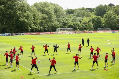 070617 - Wales Football Training Session - The Wales Squad warm up at the start of the training session ahead of the FIFA World Cup Qualifying match against Serbia