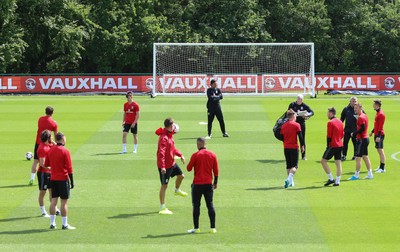 070617 - Wales Football Training Session - The Wales Squad warm up at the start of the training session ahead of the FIFA World Cup Qualifying match against Serbia