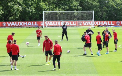 070617 - Wales Football Training Session - The Wales Squad warm up at the start of the training session ahead of the FIFA World Cup Qualifying match against Serbia